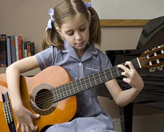 Nicola Brand Strings Students - Girl Playing Guitar